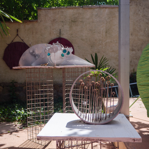 Wire sphere sculpture on a table in the garden